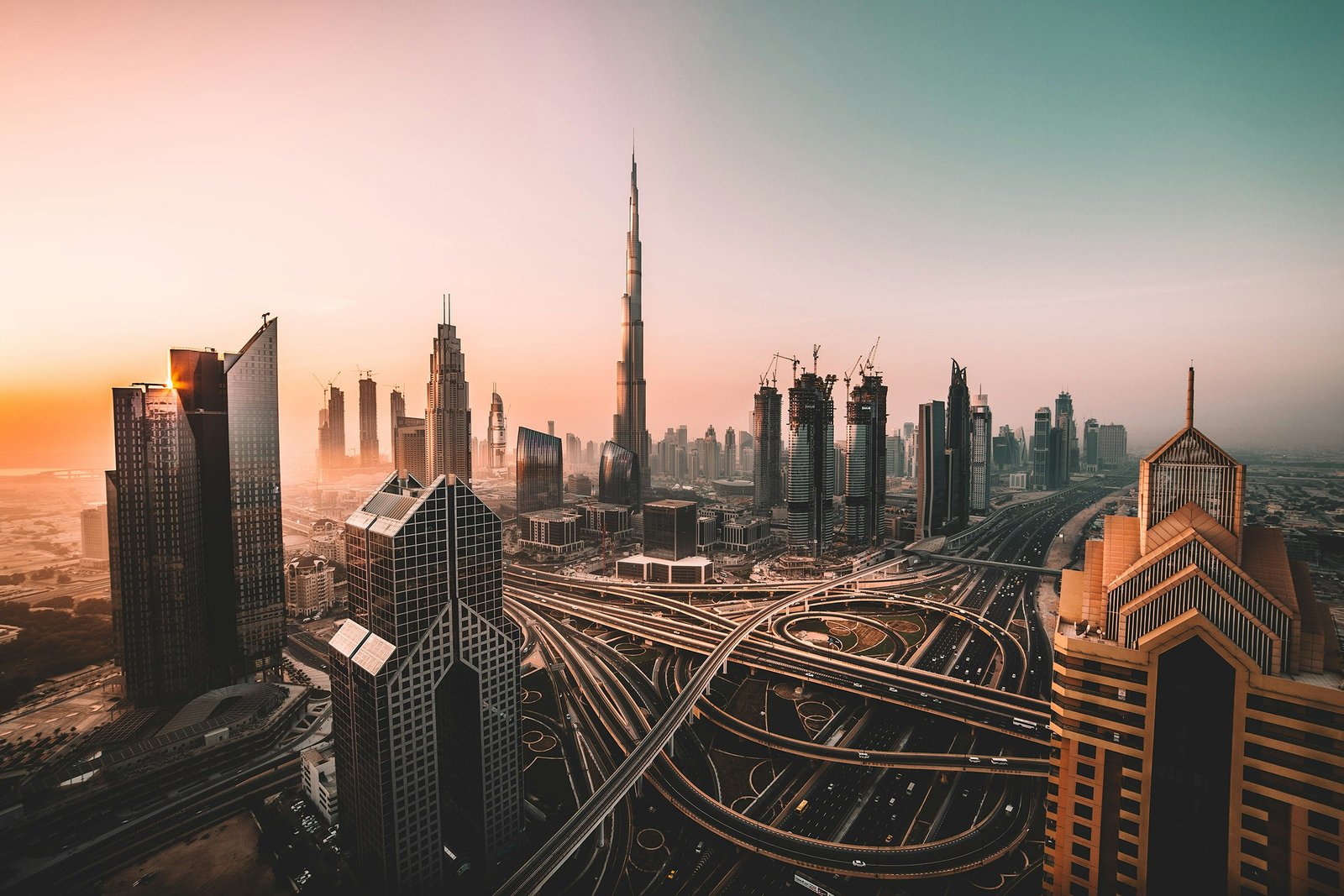 Dubai skyline at golden hour — the Burj Khalifa above Sheikh Zayed Road